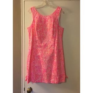 Bright pink Lilly Pulitzer dress—flamingo pattern